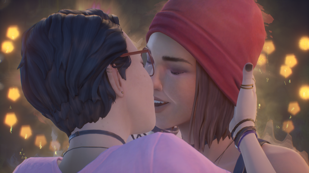 Screenshot of Alex Chen and Steph Gingrich kissing. Steph is wearing a red beanie and is smiling. Alex is wearing a light pink shirt and is cupping Steph's face with one of her hands. There is a golden glow around both of them.