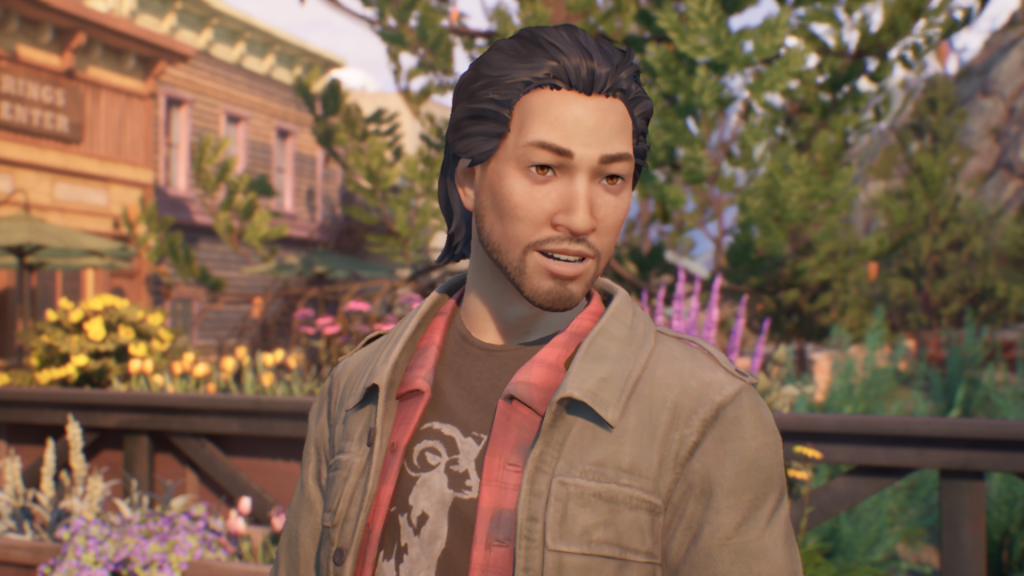 Screenshot of Gabe Chen. He is wearing a black graohic t-shirt with a red flannel and a sand-green colored jacket on top.