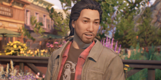 Screenshot of Gabe Chen. He is wearing a black graohic t-shirt with a red flannel and a sand-green colored jacket on top.