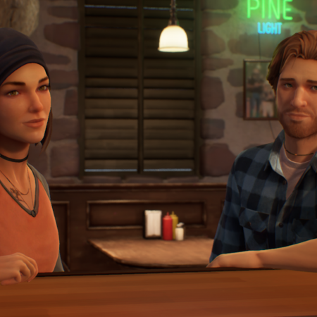 Screenshot of Steph Gingrich and Ryan Lucan in The Black Lantern. Both of them are resting an arm onto the bar they are sitting at. Ryan is wearing a blue-purple checkered flannel, Steph is wearing a black beanie and a red shirt with black sleeves.
